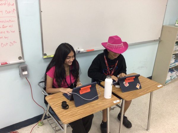 Freshman students Hiba Haseeb and Danny Iziquio, doing their missing work together in Mr. Asencios class.