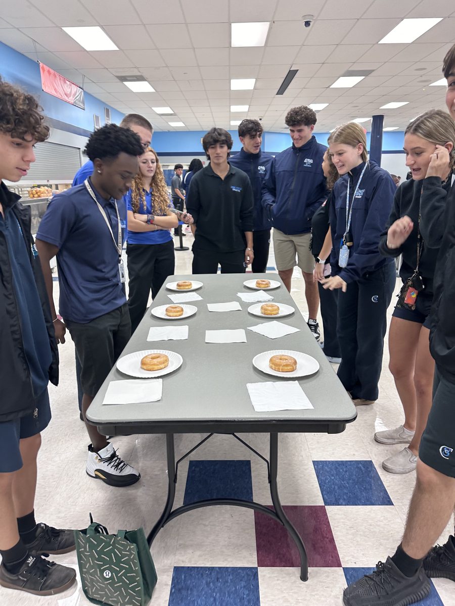 DECA Members prepare to compete in a donut eating competition.