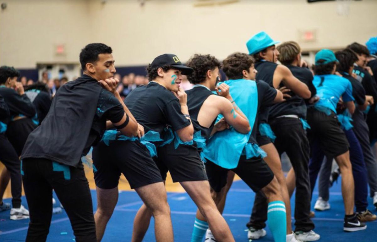 Charter boys performed a dance at pep rally. Held in the gym, the boys gave it there all in the name of school spirit.