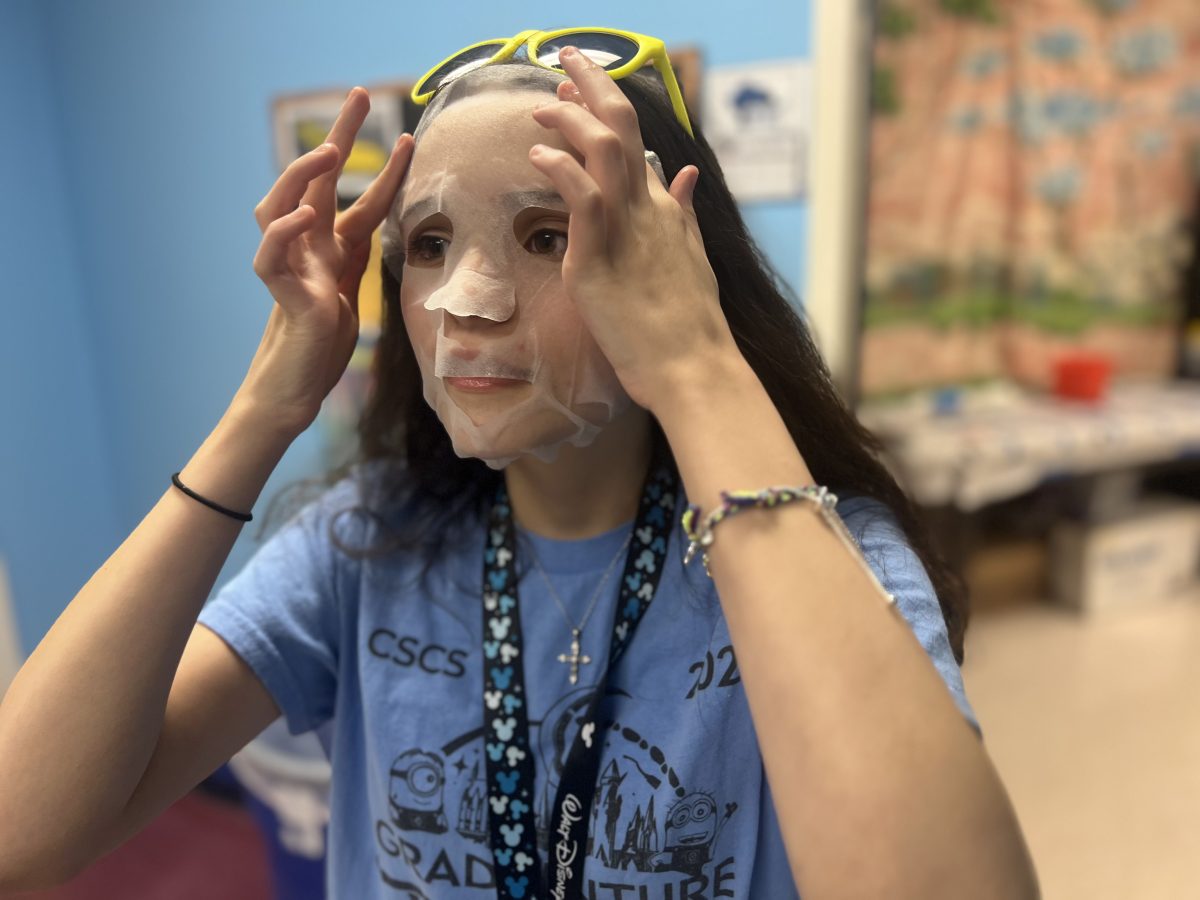 Freshman Carolina Rodriguez applies Sephora Collection Watermelon Hydrating Face Mask. These face masks retail for around $6, but are not a crucial step in a skincare routine.