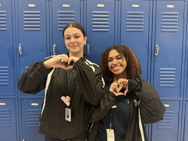 Seniors Kyhana Lechuga and Alexcia Scheinman smiling together showing their support and love for all women.