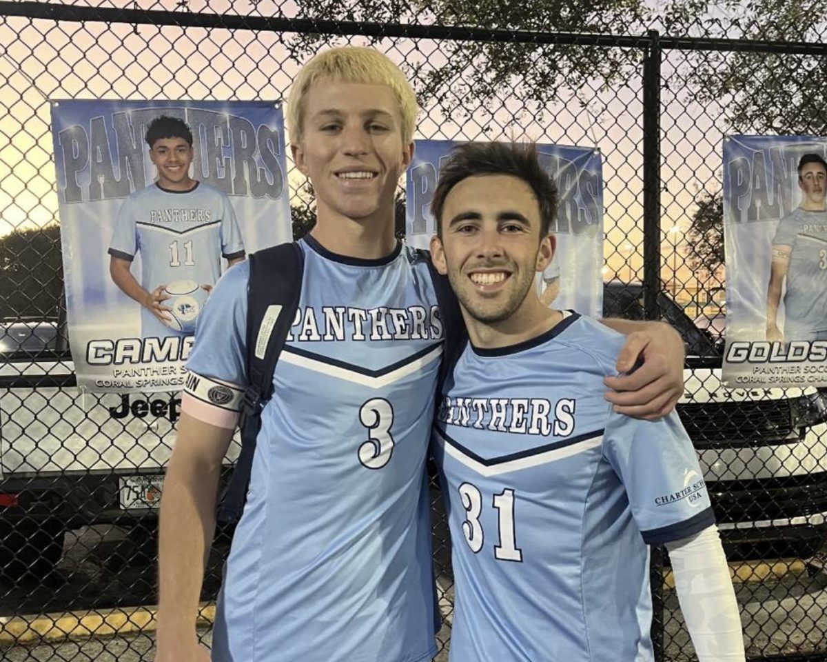 Senior Panthers Brandon Moll (Left) and Jaxson Goldstein (Right) posing for a picture after the win against Pompano.