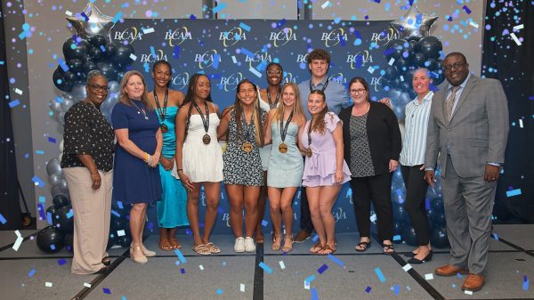 Student athletes Carson Dubich, Abby Foster, Adrianna Harris, Jaide Keen, Alexis Newland, Maria Rojas, and Jaia White at the Scholar Athlete banquet, after they received their recognitions. 